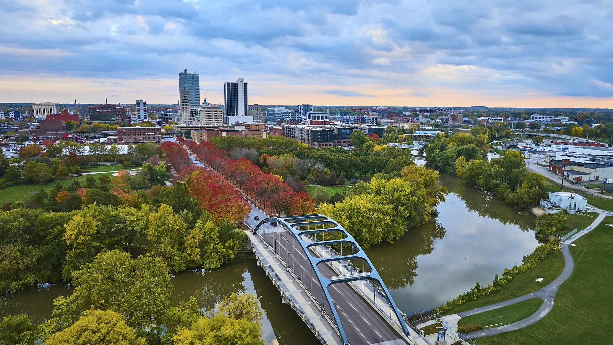 Aerial view of city skyline and river bridge