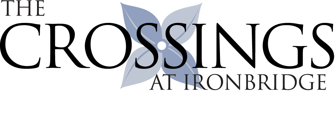 The Crossings at Ironbridge logo with flower